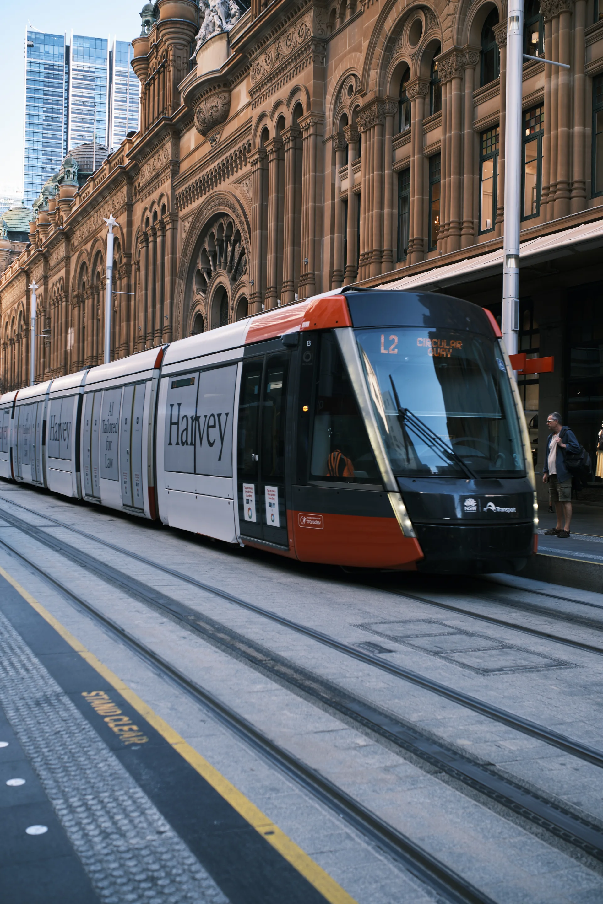 Sydney light rail passing the Queen Victoria Building on George Street